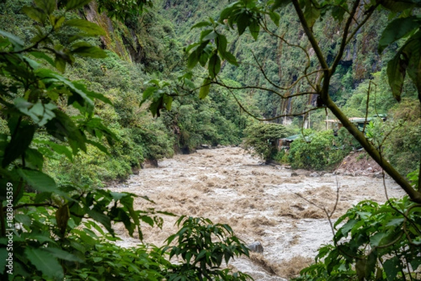 Fototapeta Scenic dramatic view with the powerful waters of Urubamba River crossing the Sacred Valley in Aguas Calientes