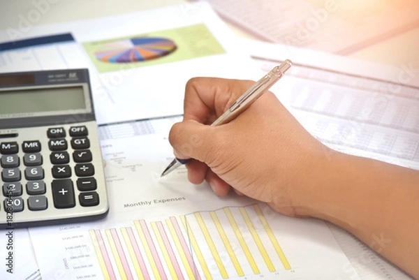 Fototapeta Review accounting data and calculate production income.