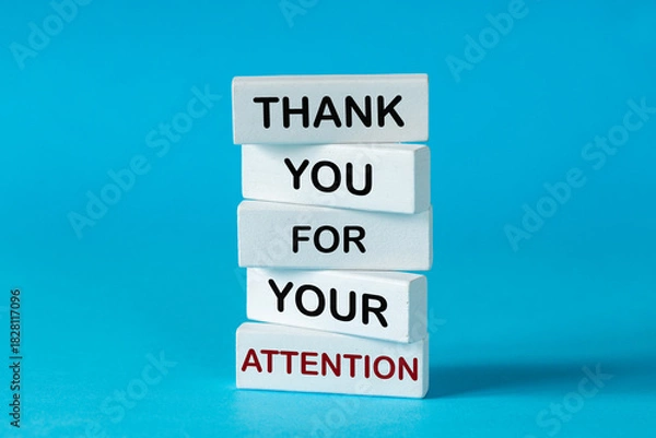 Fototapeta Thank you for your attention concept. Business symbol. Wooden blocks with words Thank you for your attention. Beautiful blue background. Attention symbol


