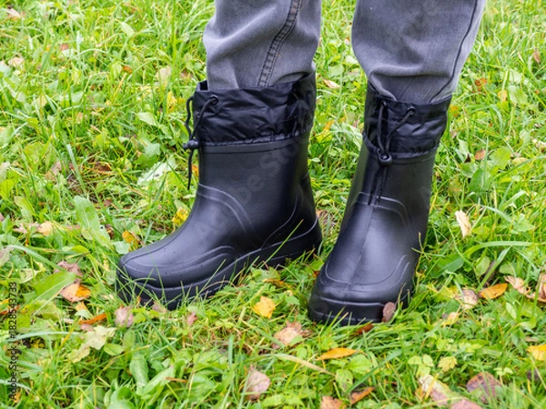 Fototapeta Unisex ultra warm insulated winter ankle boots. Waterproof rubber shoes for cold weather. Designed to keep you warm and dry in the worst of outdoor weathers 