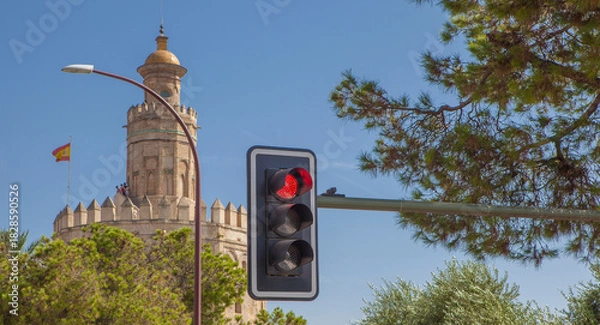 Obraz Red traffic light with the Torre del Oro of Seville