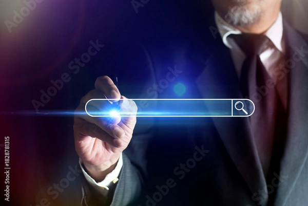 Obraz Businessman's hand using a pen touching to search browsing internet data information with blank search bar. SEO search engine optimization technology.