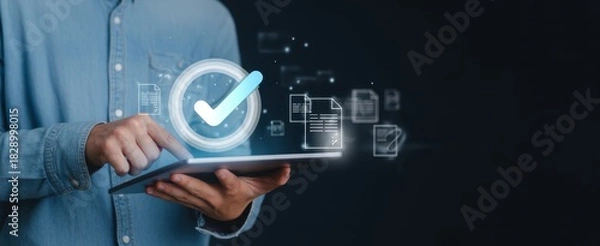 Fototapeta Digital Approval: A close-up view shows a person interacting with a digital interface, a glowing checkmark, symbolizing successful validation and approval process.