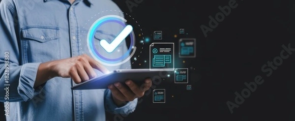 Fototapeta Digital Approval: A professional engages with a tablet, a glowing checkmark representing the completion and verification of digital documents, highlighting efficiency and modern business workflow.
