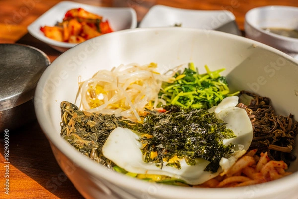 Obraz Korean Bibimbap Bowl with Fresh Vegetables and Seaweed