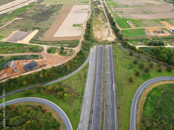 Fototapeta Aerial view of the closed highway A61 near the village of Keyenberg due to expanding mining activities, Germany