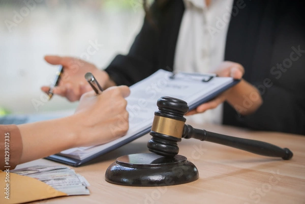 Fototapeta A professional attorney who reviews legal documents, provides fair advice, and strategic guidance in formal court matters, contracts, judgments, partnerships, rights, and powers.