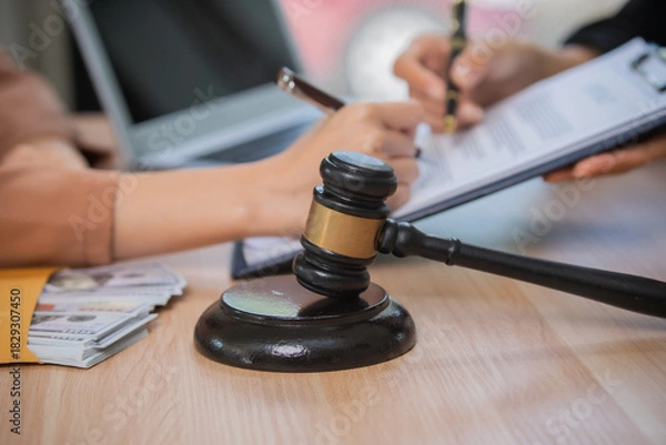 Fototapeta A professional attorney who reviews legal documents, provides fair advice, and strategic guidance in formal court matters, contracts, judgments, partnerships, rights, and powers.