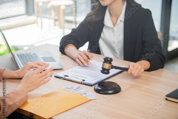 Fototapeta A professional attorney who reviews legal documents, provides fair advice, and strategic guidance in formal court matters, contracts, judgments, partnerships, rights, and powers.