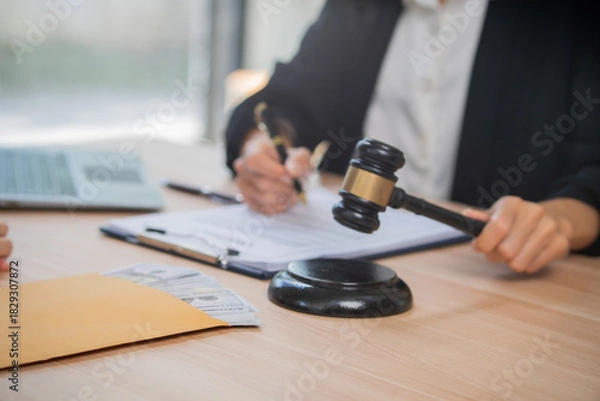 Fototapeta A professional attorney who reviews legal documents, provides fair advice, and strategic guidance in formal court matters, contracts, judgments, partnerships, rights, and powers.