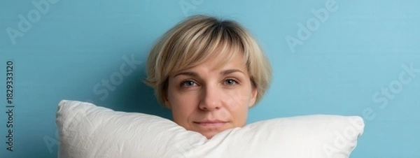 Fototapeta Introspective expression on soft pillow,relaxation