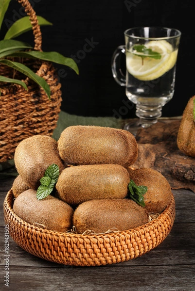 Obraz Fresh Kiwi Fruits in Basket with Water and Mint Leaves