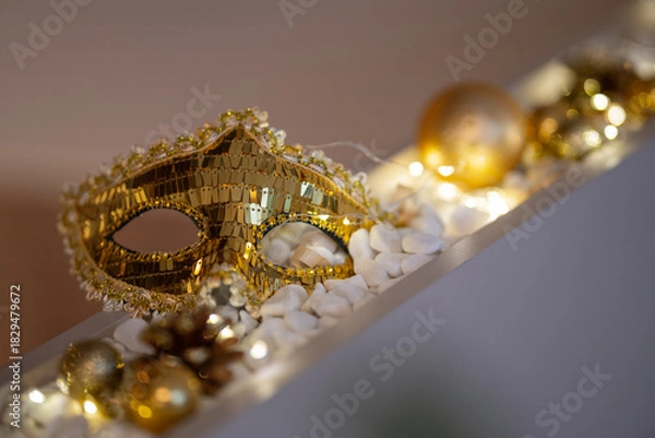Obraz A golden sequined masquerade mask