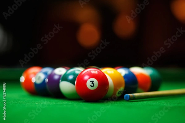 Obraz Billiard balls in a green pool table