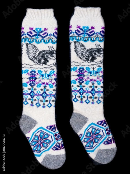 Obraz Multicolored socks on a black background.