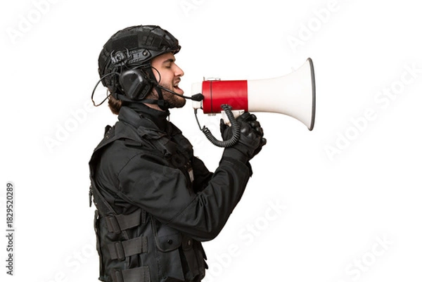 Obraz SWAT over isolated chroma key background shouting through a megaphone