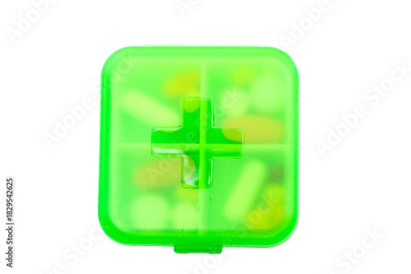Obraz Green plastic pill container on white