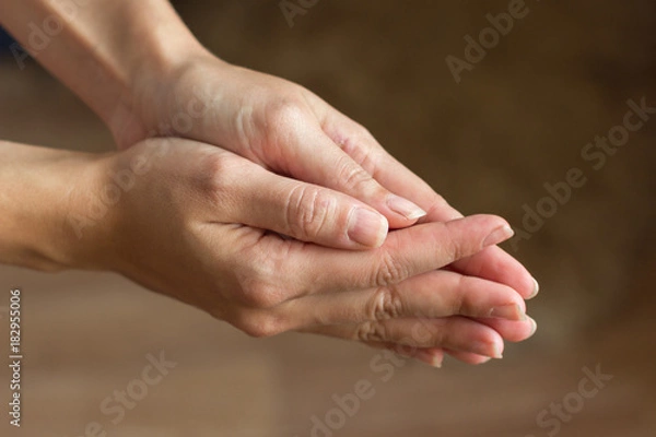 Fototapeta Hands are connected close-up. A gesture of help, supplication, repentance.