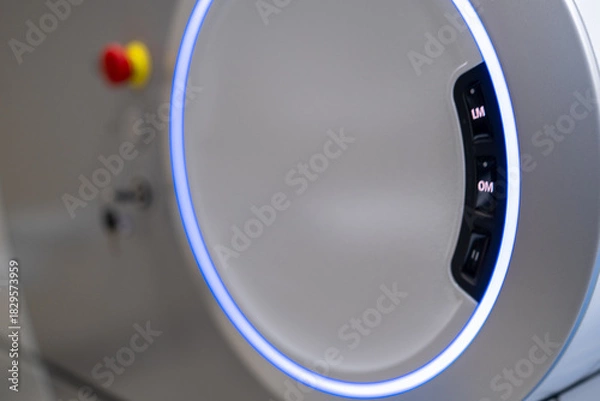 Fototapeta A close-up view of the operational control panel on the main unit of the ZEISS VISUMAX 800 Femtosecond Laser System, featuring the emergency stop, key lock, and a prominent illuminated ho