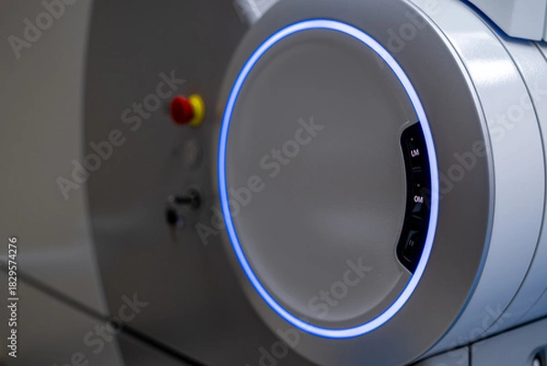 Fototapeta A close-up view of the operational control panel on the main unit of the ZEISS VISUMAX 800 Femtosecond Laser System, featuring the emergency stop, key lock, and a prominent illuminated ho