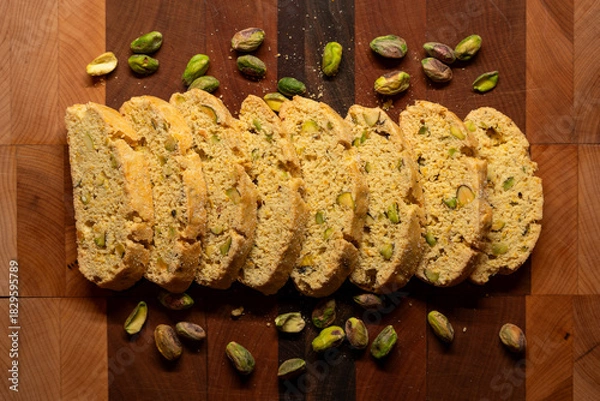 Fototapeta Artisan Italian Biscotti Arranged on a cutting board with pistachios