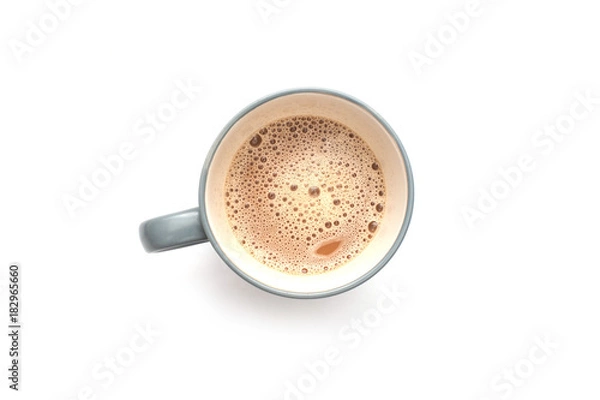Fototapeta White coffee with milk in a mug view from top isolated over white background.