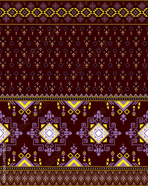 Fototapeta Vibrant ethnic seamless pattern with traditional geometric design. This cultural fabric background features intricate yellow and purple motifs on brown backdrop for textile art