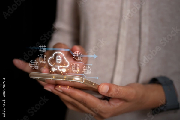 Fototapeta Digital cryptocurrency cloud payment with global logistics icons displayed above a smartphone, representing fintech, blockchain, and online transactions.
