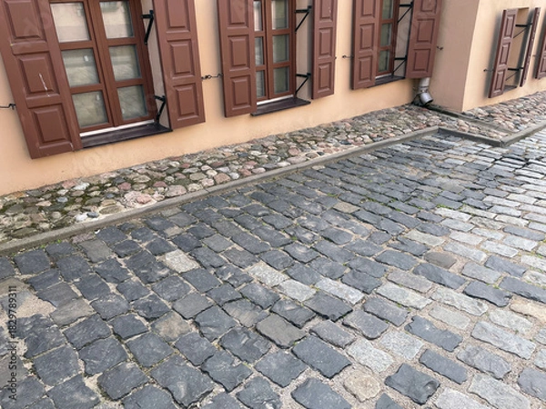 Obraz Abstract background. Old cobblestone pavement closeup