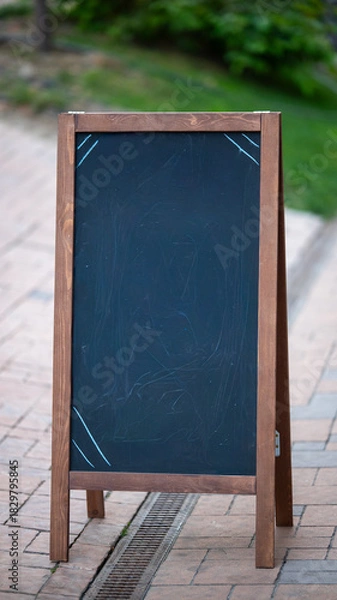 Obraz Blank chalkboard stand on sidewalk