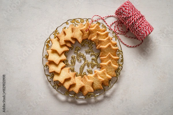 Obraz Composition of star-shaped biscuits on a Christmas plate.