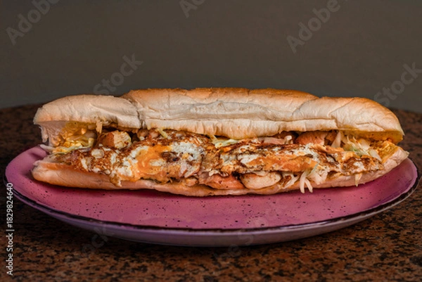 Obraz Long sandwiches with chicken breast, eggs, cabbage, cheese and dressing on plate