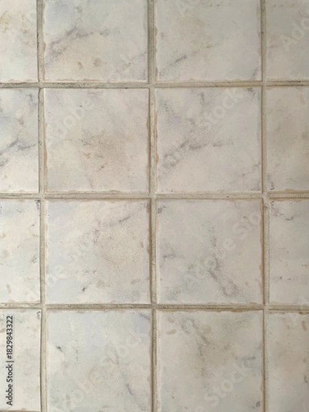 Obraz Light ceramic tile texture with a subtle marble pattern. Beige and gray tones, natural grout lines, stone surface. High-resolution background for interior design, flooring, and architecture projects.
