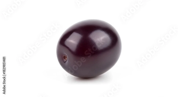 Fototapeta A single dark purple grape isolated on white background