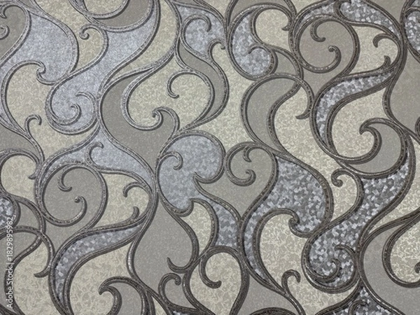 Obraz Elegant wallpaper texture featuring a shimmering silver and gray Damask pattern. Ornate, baroque-style scrolls and swirls create a luxurious, neutral background for interior design projects
