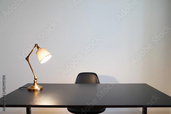 Obraz Workplace with Lamp on Dark Desk and Chair in Simple White Room Modern Workspace Interior Design for Studying or Working in Comfortable Minimalist Space