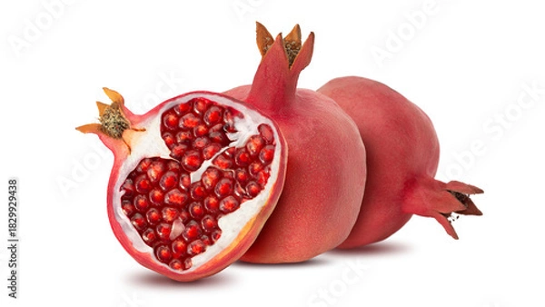 Fototapeta Fresh pomegranate cut in half with bright red seeds on a white background capturing detailed texture and color of the fruit