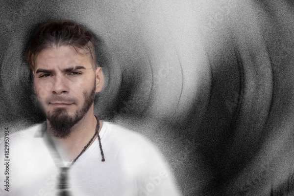 Obraz Adult male with calm expression in artistic textured background and soft motion blur.