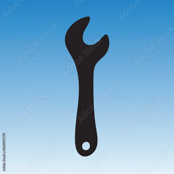 Obraz Black wrench silhouette against a blue gradient background, tool for repair