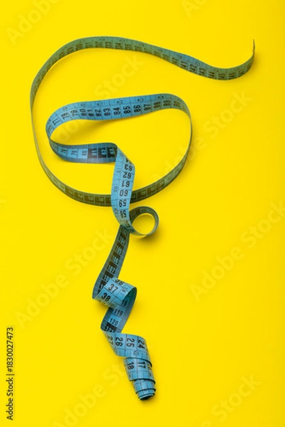 Obraz Tailor's measuring tape on yellow background