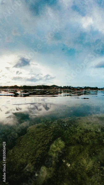 Obraz Beautiful transparent water landscape on a point of view just over the surface on a quiet beach sunset cloudscape in Chaweng, Ko Samui, Thailand