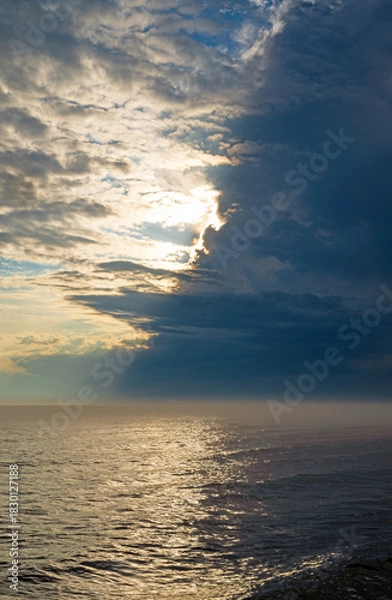 Fototapeta Tumultuous Clouds Over a Lake in the Evening