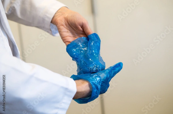 Obraz Hands of a Healthcare Provider During the Critical Stage of Glove Doffing Procedure.