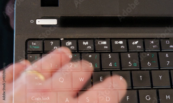 Obraz Ghost hand touching computer keyboard