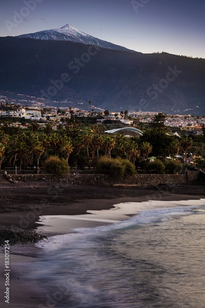 Fototapeta Scenic sunset view of Punta Brava down Playa Maria Jimenez beach with Pico del Teide volcano in the background, the highest point above sea level in the Canary Islands