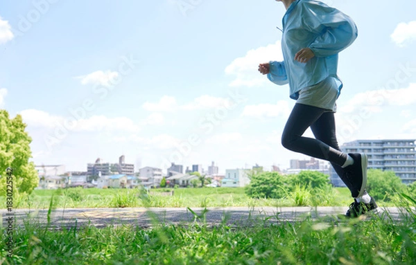 Obraz 屋外でランニングする40代女性　顔無し