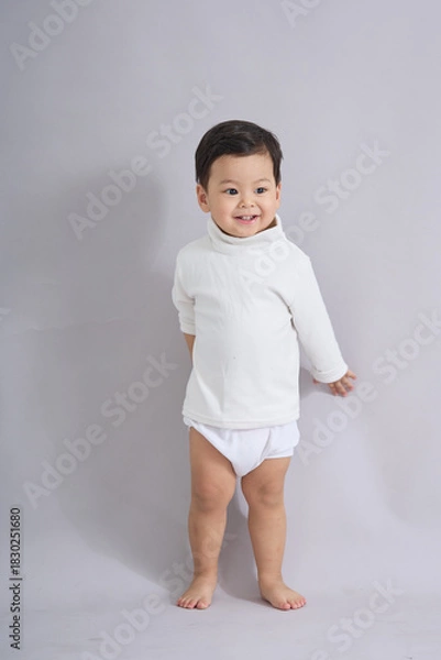 Obraz The child stands with a gentle expression.