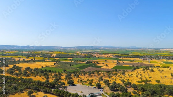 Obraz Tevfikiye, Turkey. Surrounding Ancient city of Troy agricultural fields and the Dardanelles strait in the distance on a summer day. Aerial view