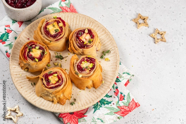 Fototapeta Deliciously baked pastry rolls filled with cherry and cream cheese served on a decorative plate