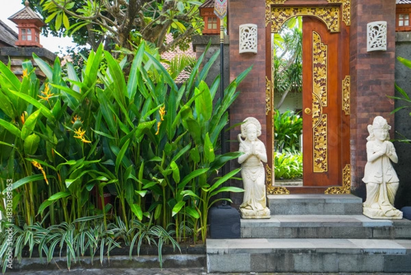 Obraz A quiet garden without many people passing by where many green tropical plants decorate it